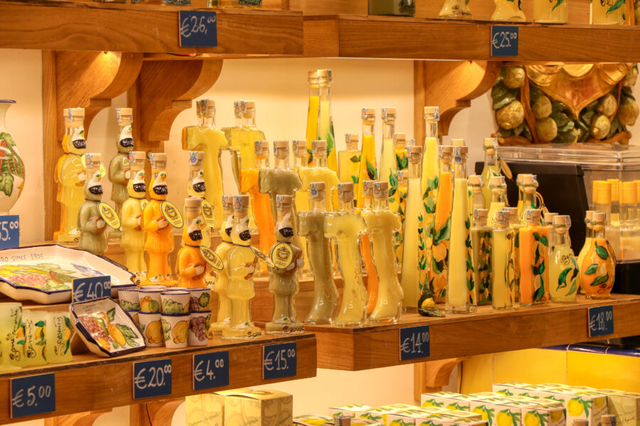 Bottles of limoncello liqueur displayed for sale in souvenir shops in Sorrento, Campania, Italy