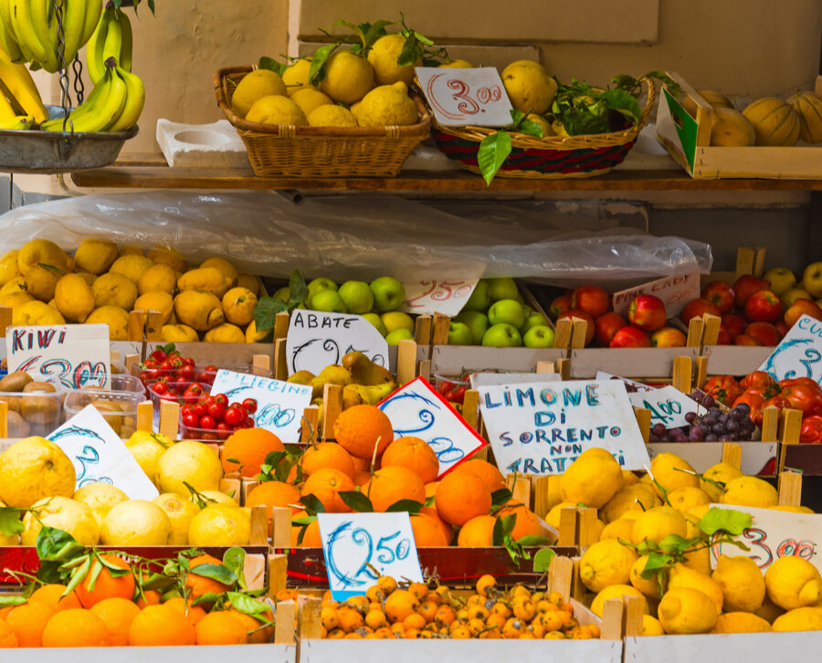 Vibrant fruit stand at Sorrento Market, displaying a variety of fresh fruits in colorful arrangements