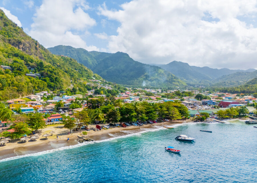 Aerial view of Soufriere Bay and beach in Saint Lucia, showcasing turquoise waters and lush green surroundings