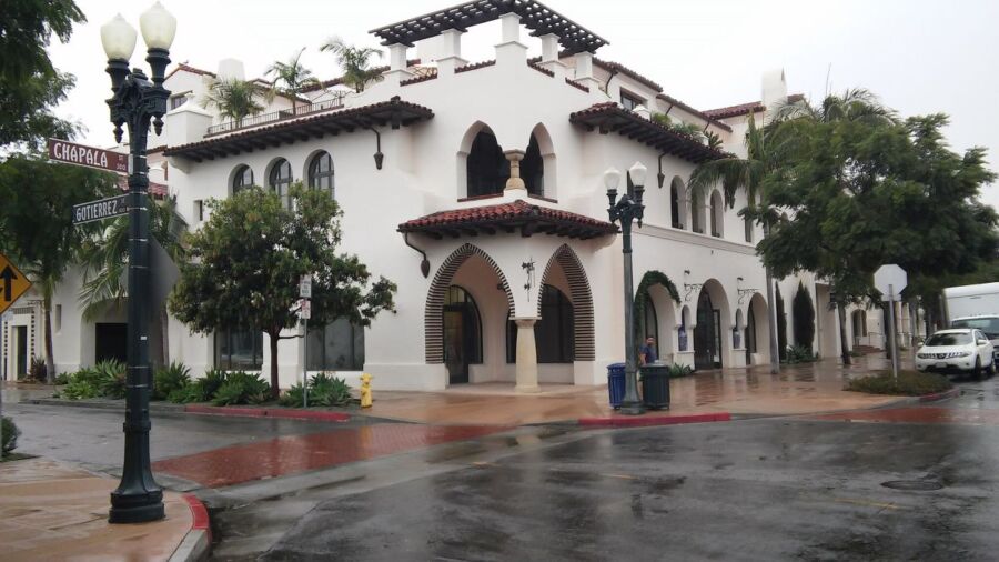 Spanish colonial revival building with stucco walls and terracotta roof at Chapala and Gutierrez intersection.