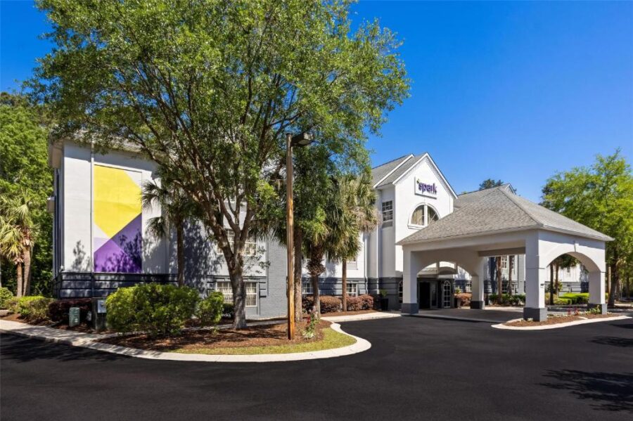 Front entrance of the Spark by Hilton Bluffton Hilton Head Island in South Carolina, showcasing modern architecture and welcoming atmosphere.
