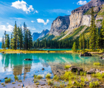 Scenic view of Spirit Island on Maligne Lake, surrounded by mountains in Jasper National Park, Alberta, Canada.