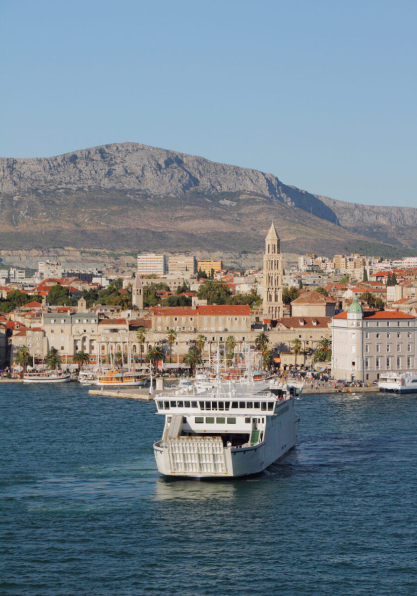 Beautiful view of Split, Croatia, with a cruise ship docked and the city's charming skyline in the background.