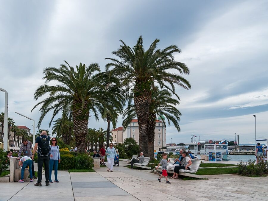 Split Riva Promenade sidewalk, showcasing urban art and culture.