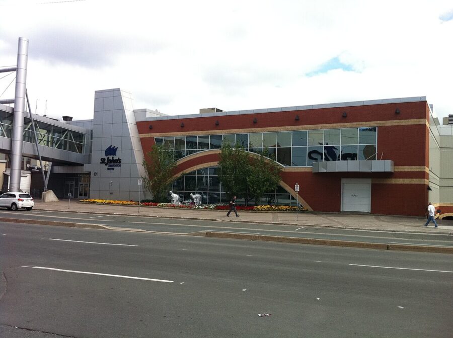 Exterior view of St. John’s Convention Centre in Newfoundland, showcasing a large sign on the building.