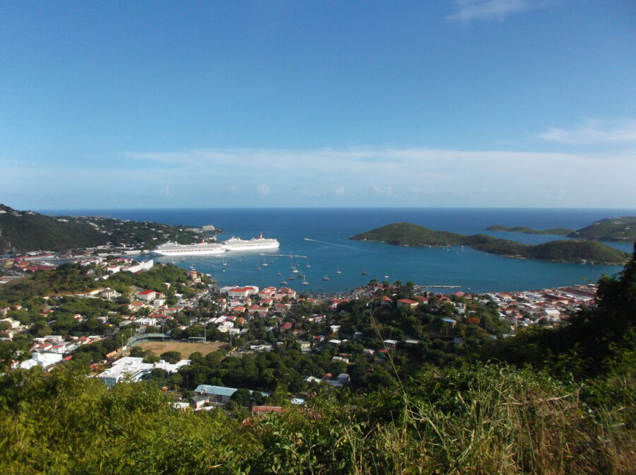 Bright blue sky dotted with white clouds above St. Thomas, US Virgin Islands, showcasing a beautiful day in the tropics.