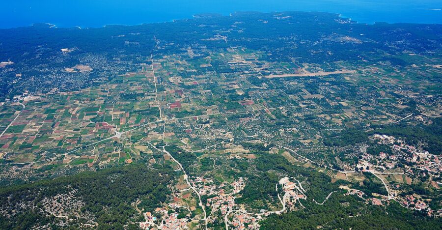 Aerial view of Stari Grad Plain, Hvar, Croatia, patchwork agricultural fields reaching the Adriatic coast.