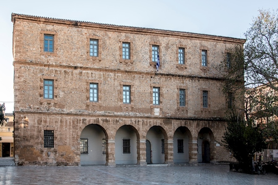 Historic Archaeological Museum of Nafplio with stone arcade and plaza.