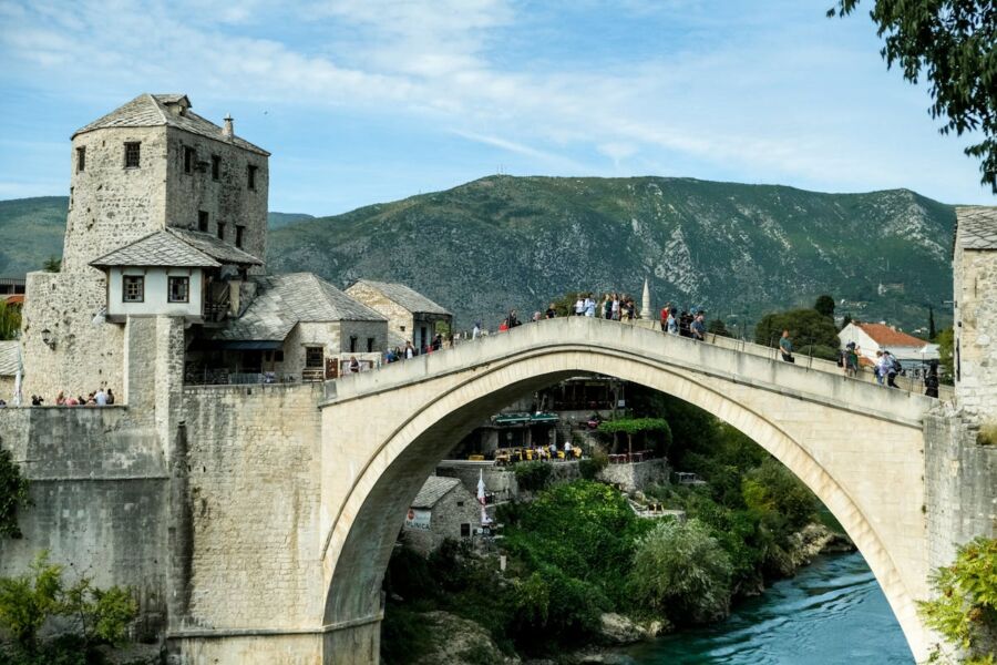 Stunning Stari Most in Mostar, Bosnia: 16th-century bridge over the Neretva, surrounded by nature.