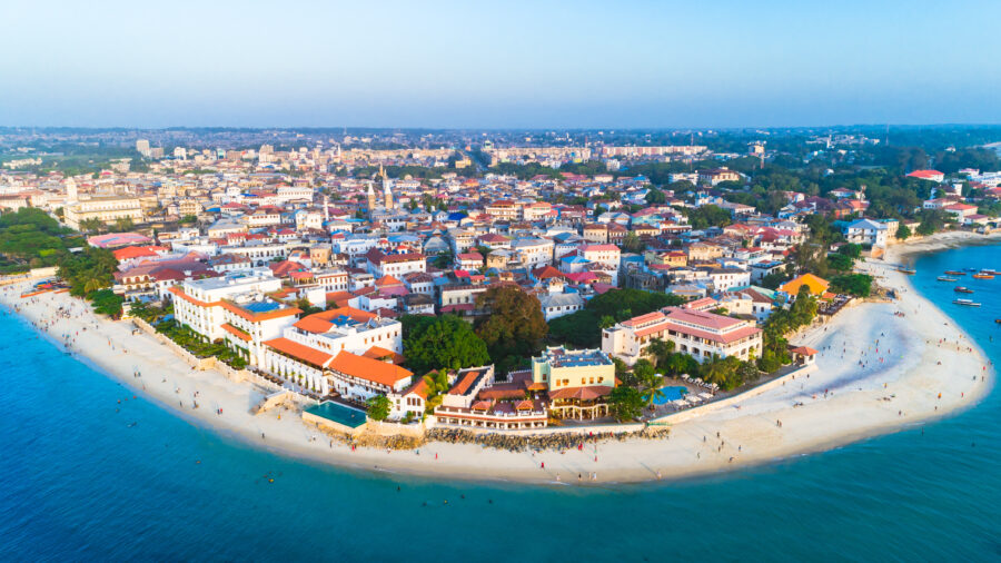 Panoramic view of Stone Town in Zanzibar, Tanzania, offers a horizon filled with historical buildings and sea