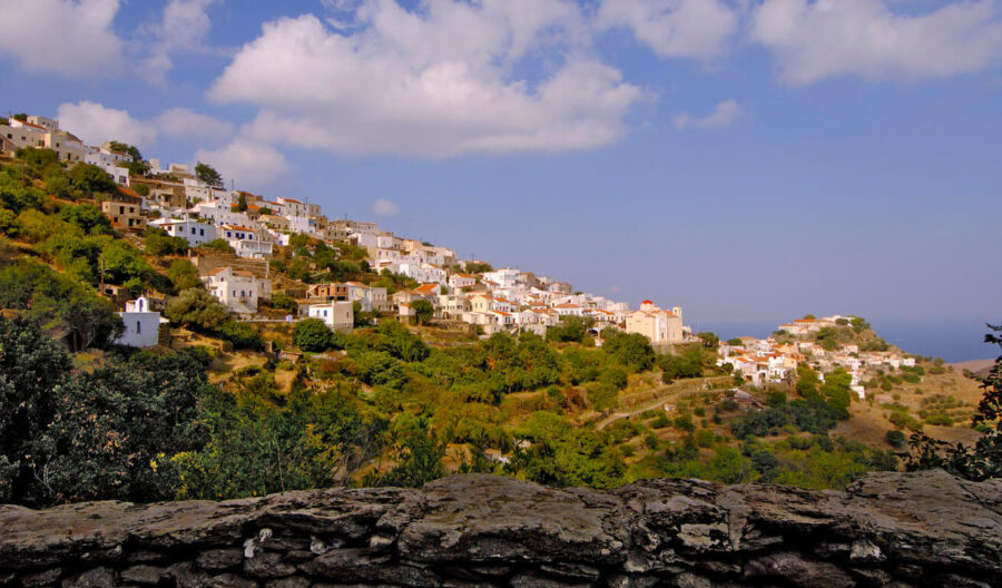 Kea hillside village with stone wall, whitewashed houses, terraced gardens and sea view.