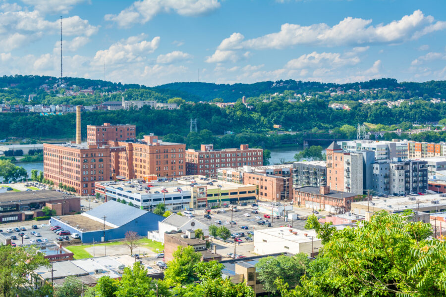Scenic view of Pittsburgh's Strip District from Frank Curto Park, highlighting city architecture and park landscape