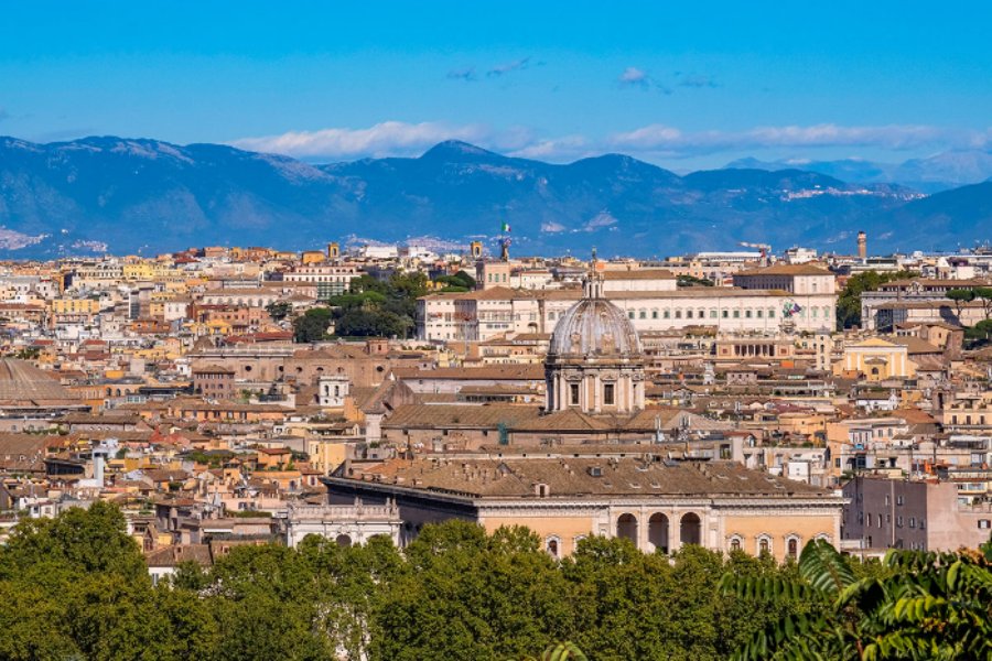 Panoramic Rome skyline with terracotta rooftops and church dome from Belvedere del Gianicolo.