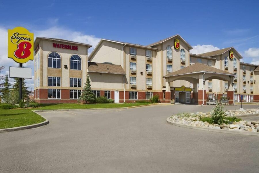 Front view of the Super 8 hotel in Edmonton, showcasing its modern architecture and inviting atmosphere.