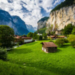 Stunning view of Lauterbrunnen in the Swiss Alps, featuring the majestic Staubbach waterfall cascading down the valley