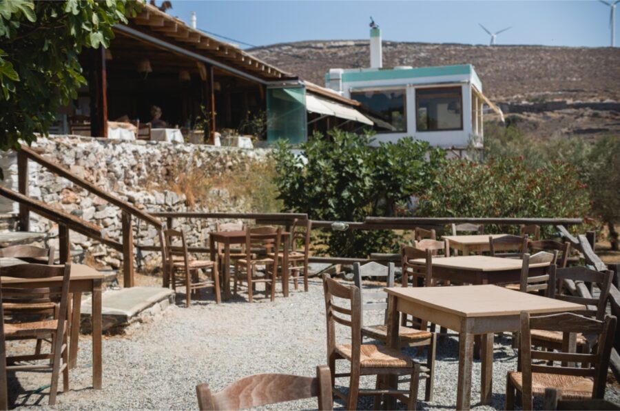 Cozy village restaurant in Syros, Greece, serving authentic dishes cooked in an old oven with local ingredients.
