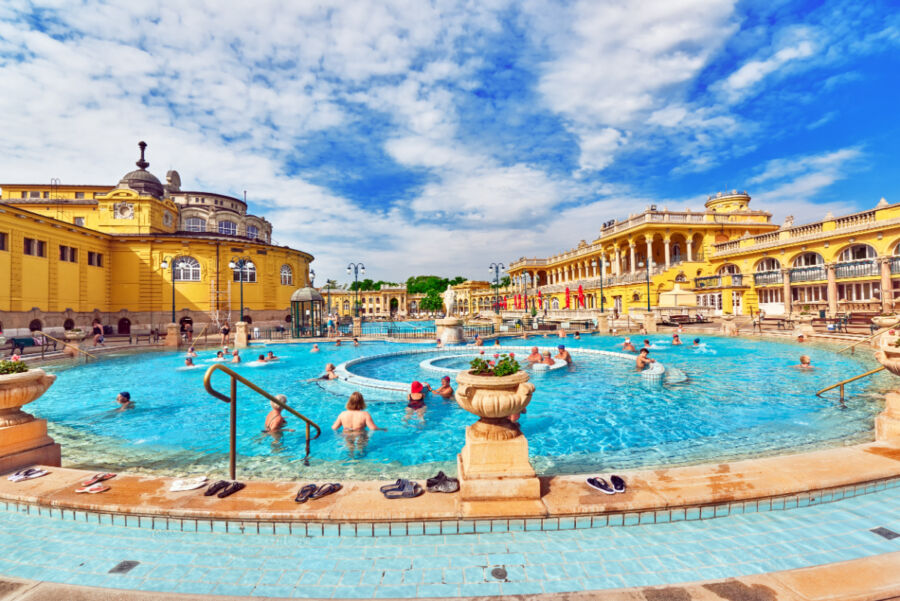 Courtyard of Szechenyi Baths in Budapest, Hungary, showcasing its stunning architecture and vibrant atmosphere