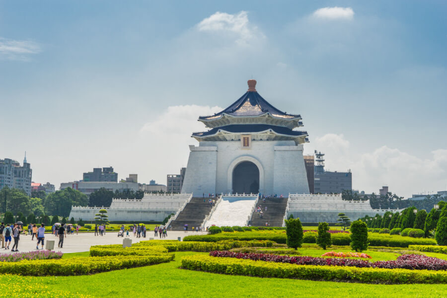 Chiang Kai-shek Memorial Hall, a notable Taipei landmark, is characterized by its impressive architecture and blue-tiled roof