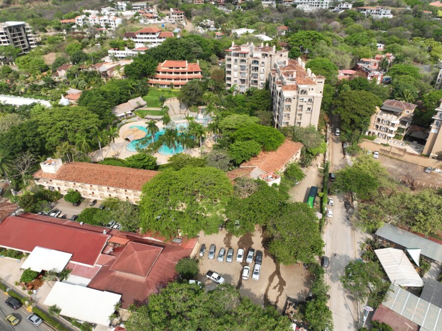 Scenic view of Tamarindo, Costa Rica, showcasing a vibrant coastal resort with palm trees and sandy beaches