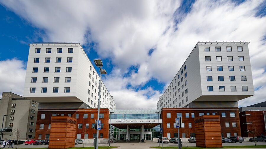 Tartu University Hospital modern clinic in Estonia with glass bridge and white towers.
