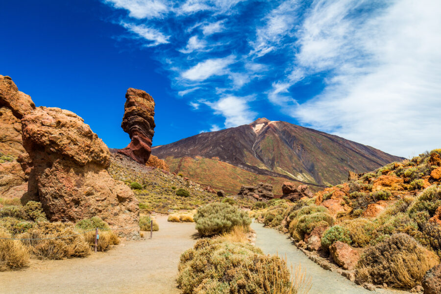Scenic view of Roques de Garcia and Teide volcano under bright morning light in Teide National Park, Tenerife, Spain