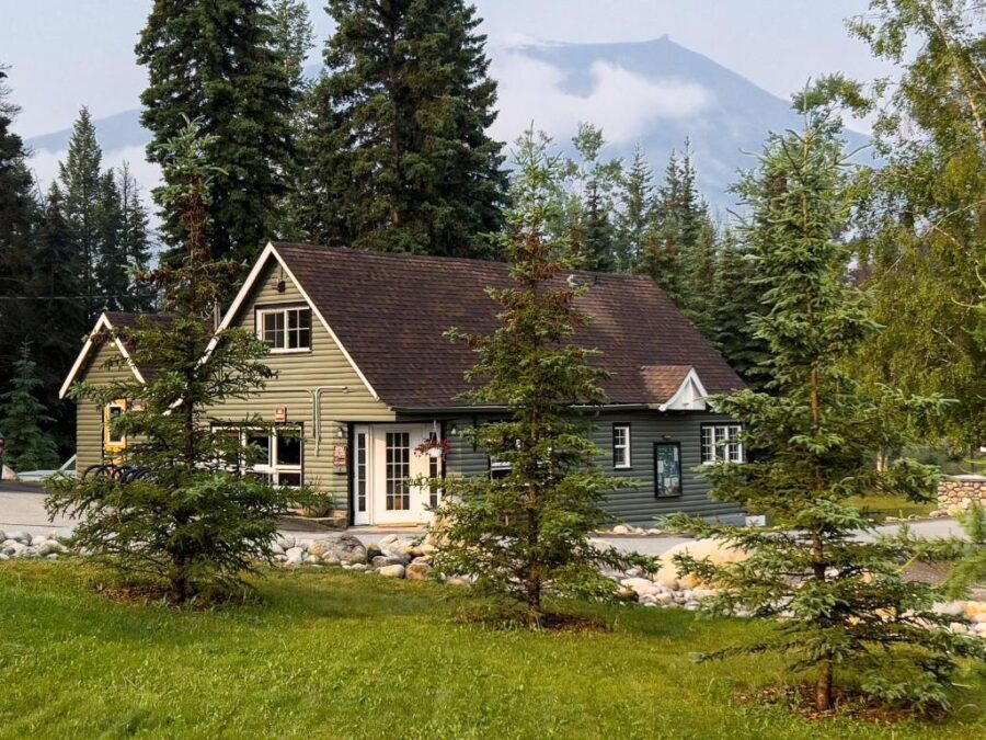 Tekarra Lodge cabin surrounded by stunning mountain scenery in Jasper, Canada.
