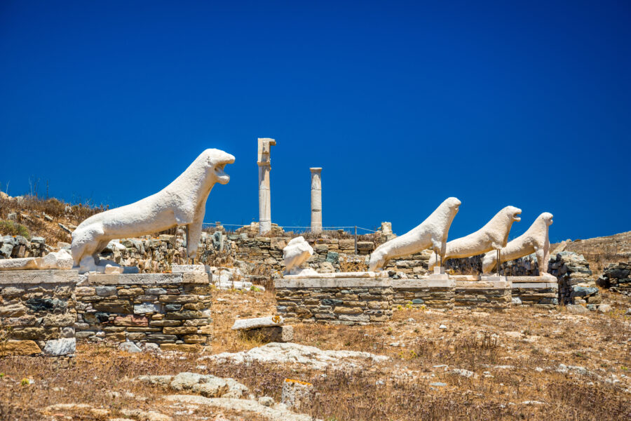 Ancient ruins on Delos Island, a significant archaeological site in Greece, showcasing its rich mythological and historical heritage.
