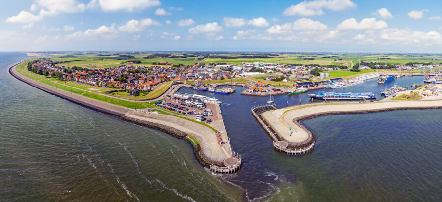 Panoramic aerial image of Oudeschild, a historic town on Texel island, highlighting its unique layout and natural surroundings