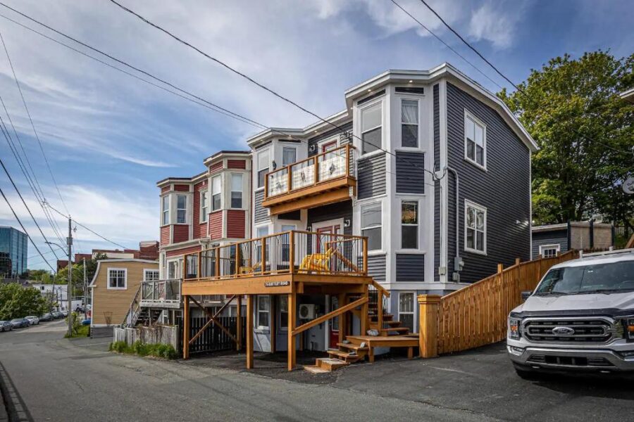 Exterior view of The Battery Harbour Home, a bed & breakfast in St. John, Canada, featuring ocean and city vistas.