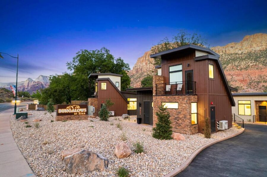 Exterior view of The Bungalows at Zion, showcasing a home with a stunning mountain backdrop in Springdale.
