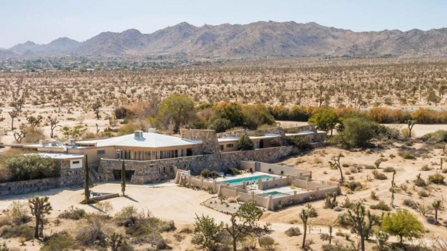 Aerial view of The Bungalows by Homestead Modern, showcasing a modern desert home surrounded by arid landscape.