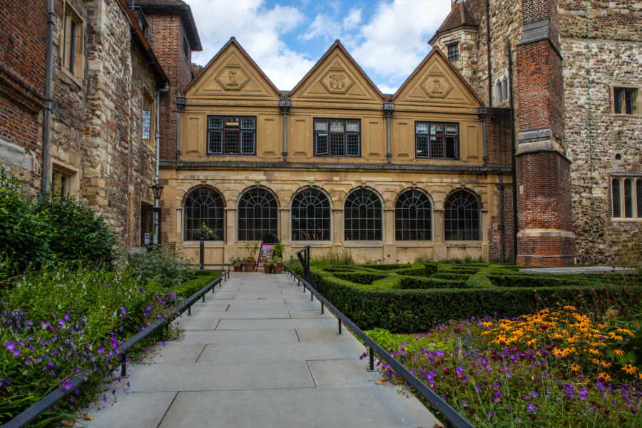 Exterior view of the Charterhouse in London, showcasing its historic architecture and surrounding greenery