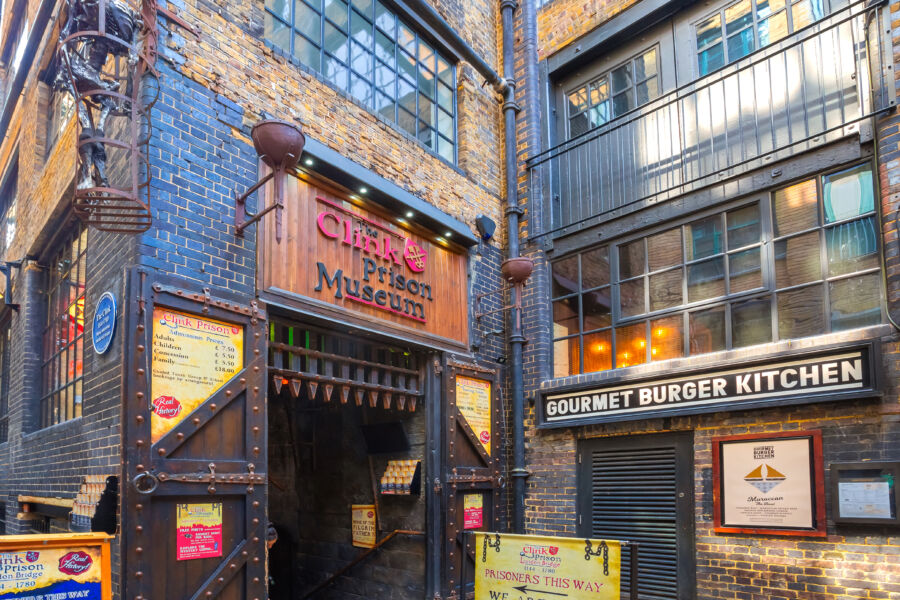 Exterior view of The Clink Prison Museum with a prominent entrance sign showcasing its historical significance