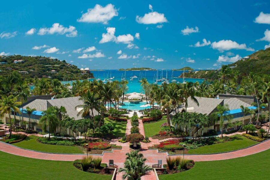 The Westin St. John Resort Villas, showcasing a luxurious tropical setting with palm trees and ocean views.