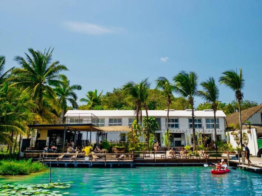 Yak Lake House resort in Bacalar, Quintana Roo, Mexico, under a clear sky.