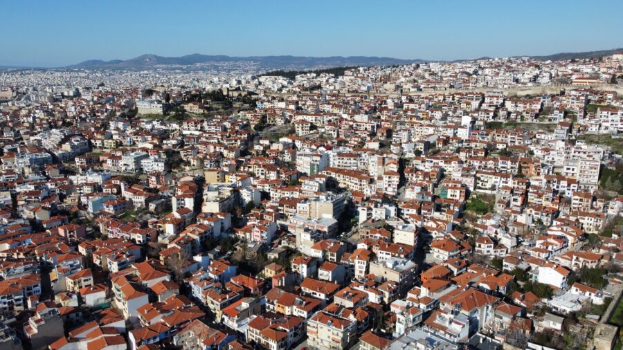 Panoramic view of Thessaloniki, Greece, showcasing the city's skyline and coastal landscape under a clear blue sky