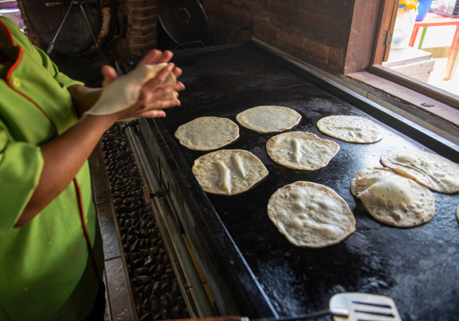Flour tortillas cooking on a large comal in a Mexican restaurant in Todos Santos, Baja California Sur, Mexico