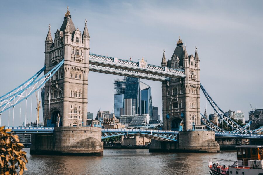 Londons iconic Tower Bridge spans the Thames, blending historic architecture with modern skyline.