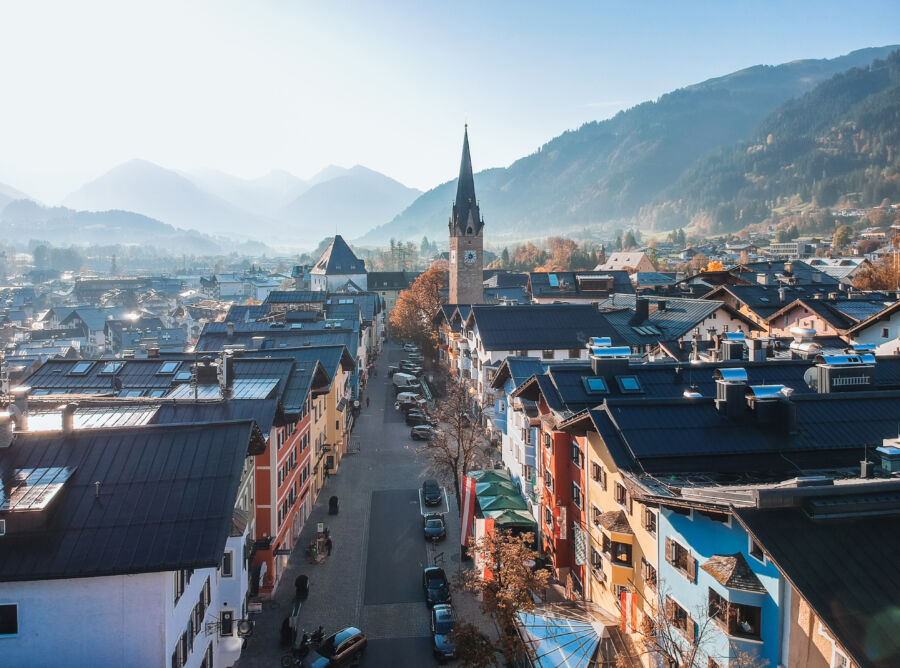 Scenic autumn view of Kitzbühel, an exclusive ski resort in the Kitzbühel Alps, Tyrol, Austria, surrounded by colorful foliage