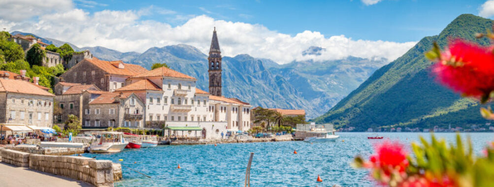Summer view of the historic town of Perast, nestled along the Bay of Kotor in Montenegro, showcasing its charming architecture.