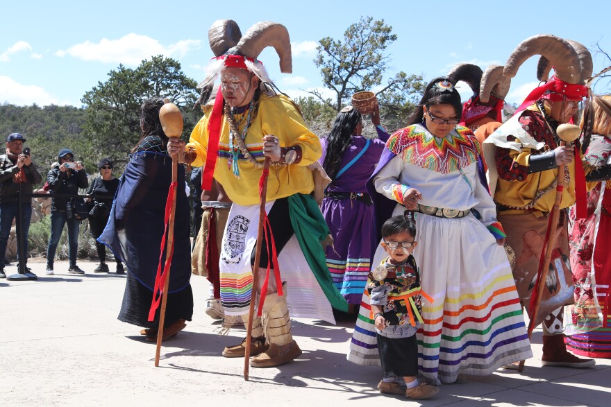 Traditional dance ceremony featuring colorful attire and cultural heritage at Havasupai Tribe celebration.