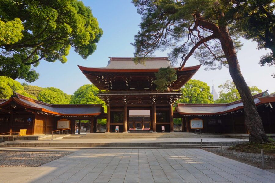 Meiji Shrine traditional wooden torii gate and serene courtyard in Tokyo.