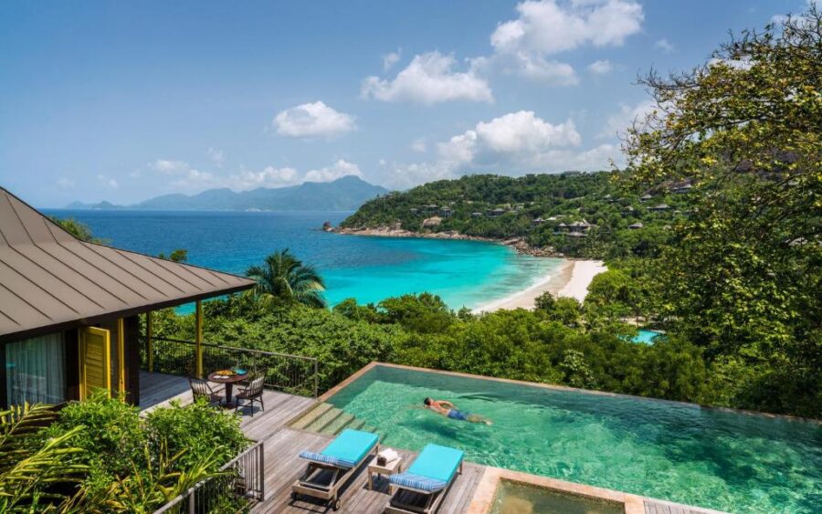 Luxury Seychelles hillside villa with infinity pool, ocean view, tropical beach and lush jungle.