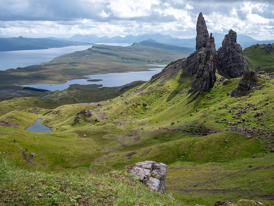 Panoramic view of the Isle of Skye from the summit of a mountain, showcasing the Trotternish Peninsula's rugged landscape.
