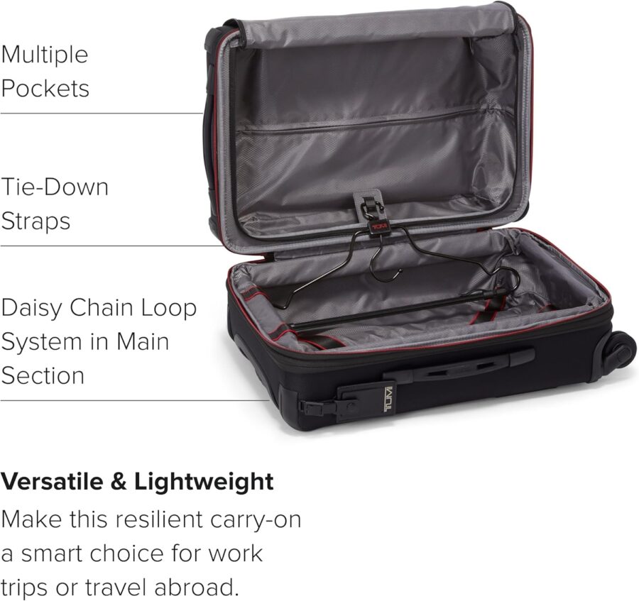Interior view of a TUMI Aerotour suitcase, featuring labeled sections that highlight its expandable capacity and contents.
