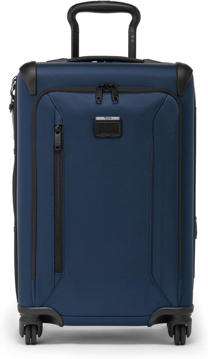Navy TUMI Aerotour trolley bag featuring four wheels and an expandable design for convenient travel.