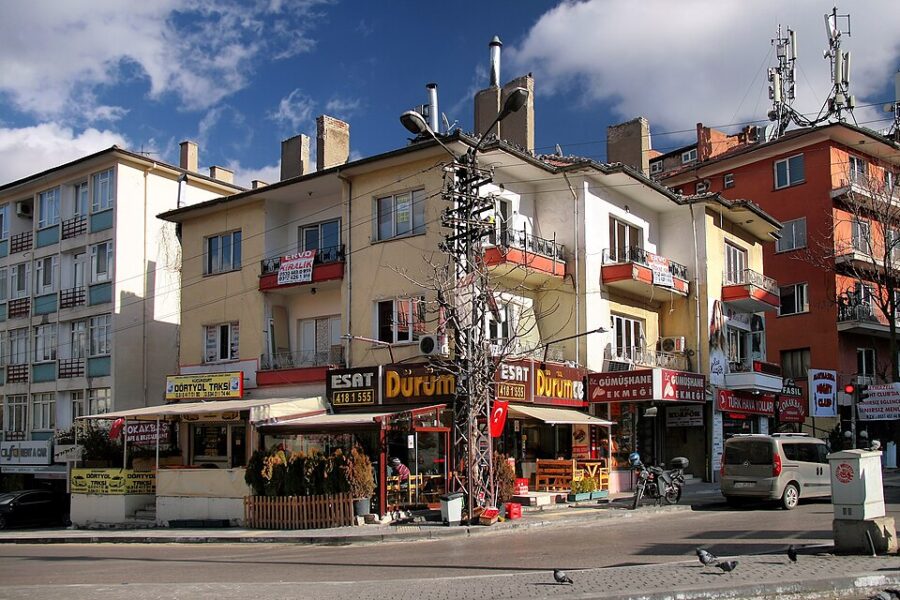 Busy street scene on Tunali Hilmi Caddesi in Ankara, filled with numerous buildings and crowds of people.