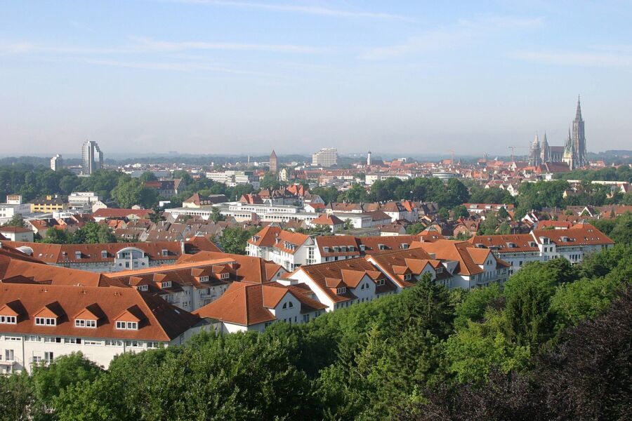 Panoramic view of Ulm's cityscape in Germany, showcasing its historic architecture and modern buildings.