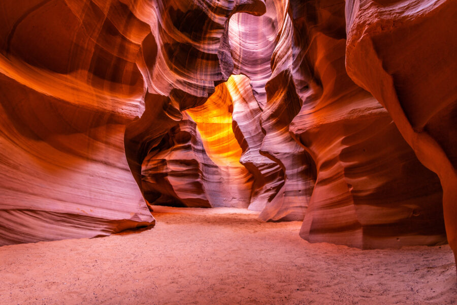 Upper Antelope Canyon features stunning, smooth sandstone walls with rich colors, creating a dramatic, narrow corridor.