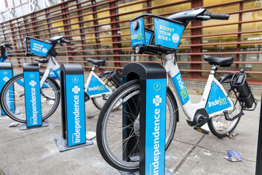 Indego e-bikes at North Philadelphia bike-sharing station, promoting eco-friendly urban transport.